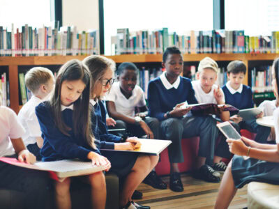 Diverse Students Wearing Uniforms In School